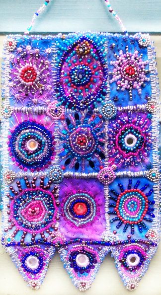 Beaded wall hanging in blue